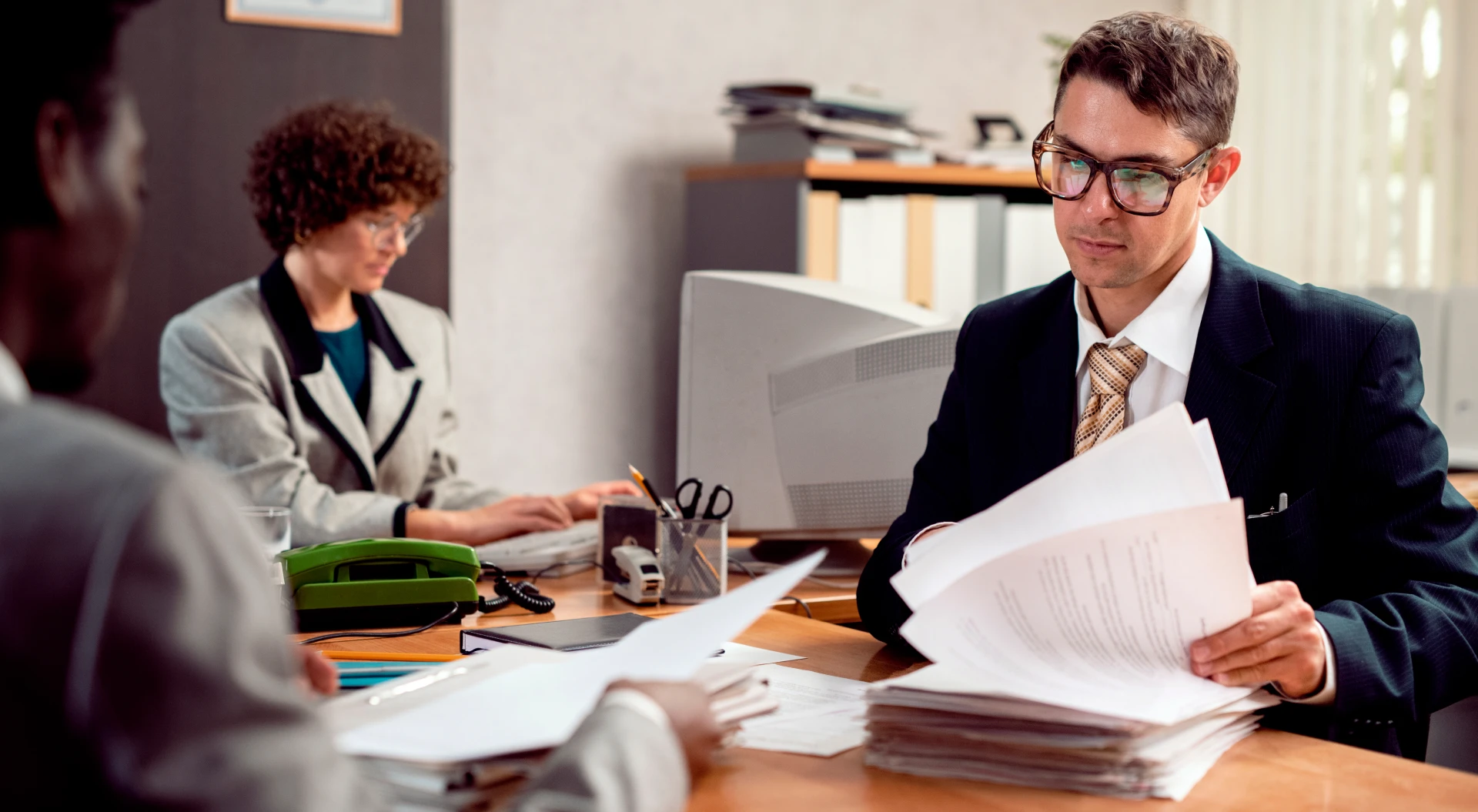 Ontario personal injury lawyer reviewing IME report and accident benefit documents on behalf of injured claimant